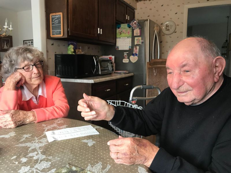Jackie and Marty Smith, who met as Jacqueline Virginie Guillaume and Martin Schmidt in France after World War II, were teenage refugees who married in 1951 and later immigrated to this area. They are shown here in the kitchen of their Lakes of the Four Seasons home. (Jerry Davich)